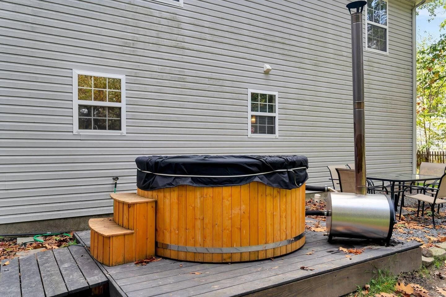 Wood-burning hot tub on outdoor deck